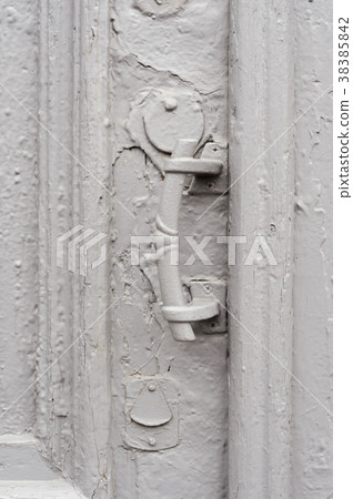 Close-up keyholes with curtains and a handle on 38385842