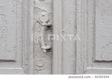 Close-up keyholes with curtains and a handle on 38385844