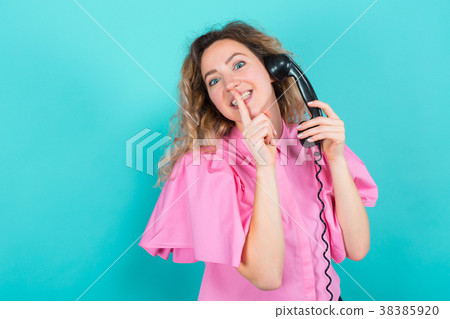 Woman in shirt with telephone 38385920