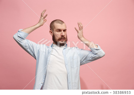 Beautiful man in stress isolated on pink Beautiful man in stress isolated on pink 38386933