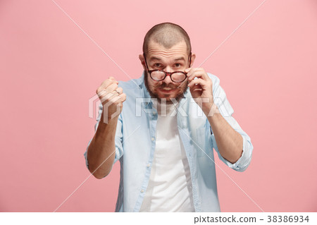 Portrait of an angry man looking at camera Portrait of an angry man looking at camera 38386934