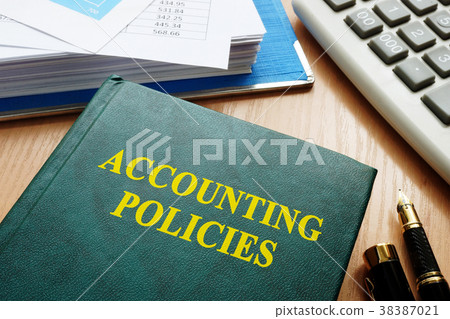 Book with title accounting policies on a table. 38387021