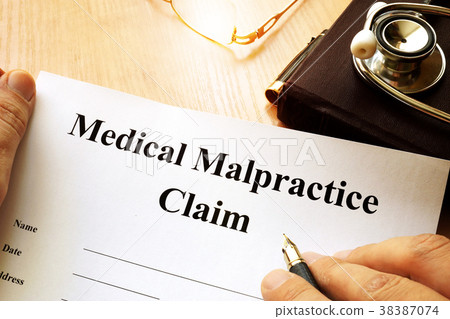 Medical Malpractice Claim on a table. Medical Malpractice Claim on a table. 38387074