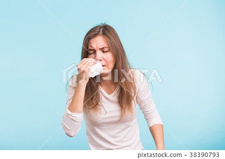 Young woman with handkerchief. Sick girl isolated Young woman with handkerchief. Sick girl isolated 38390793