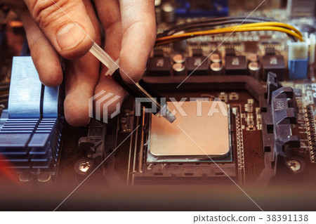 applying thermal paste on the processor 38391138