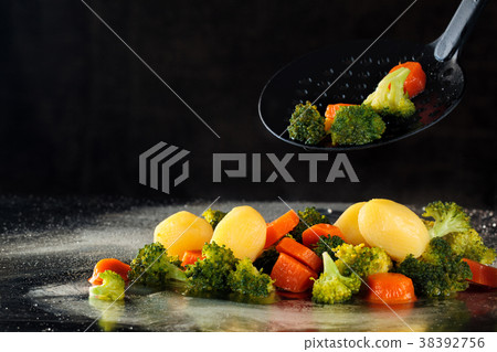 Steamed vegetables on tray. Steamed vegetables on tray. 38392756