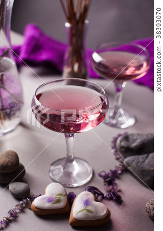 A magical lilac drink in a mysterious evening sett A magical lilac drink in a mysterious evening sett 38393070