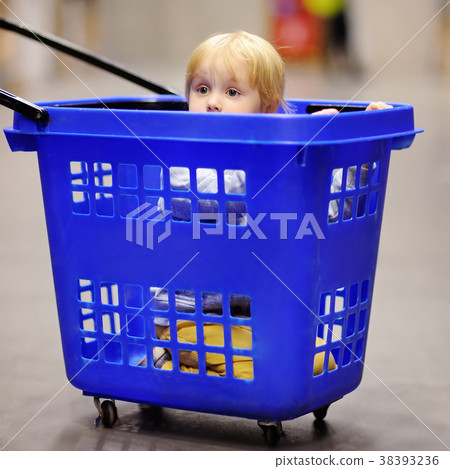 little boy in the plastic shopping cart little boy in the plastic shopping cart 38393236