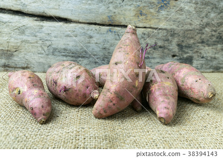 yam on wooden table yam on wooden table 38394143