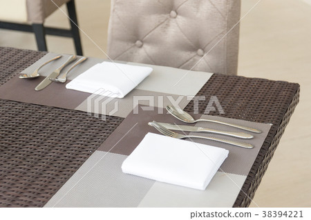 Luxurious fork and spoon on the dining table 38394221