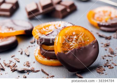 Candied orange slice in chocolate Slate background 38394784
