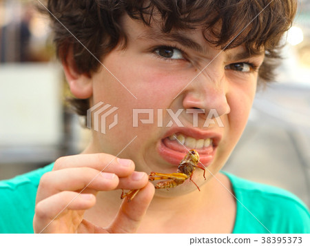 boy with disgust grimace hold unusial strange thai 38395373