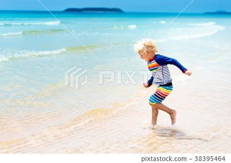 Child on tropical beach. Sea vacation with kids. 38395464