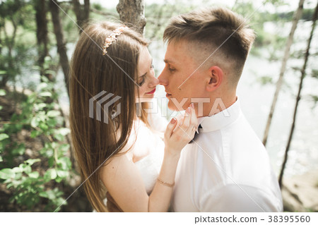 Wedding couple man, bride kissing and hugging on a Wedding couple man, bride kissing and hugging on a 38395560