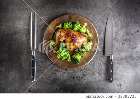 Roasted chicken Leg. Chicken leg with broccoli. Roasted chicken Leg. Chicken leg with broccoli. 38395723
