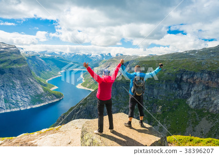 Couple posing on Trolltunga Norway Couple posing on Trolltunga Norway 38396207