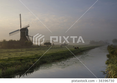 Wingerdse mill in misty morning atmosphere 38396730