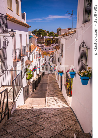 Picturesque street of Mijas. Charming white  38397905