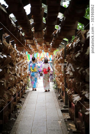 Young women in yukatas coming out of the Ema tunnel Young women in yukatas coming out of the Ema tunnel 38398862