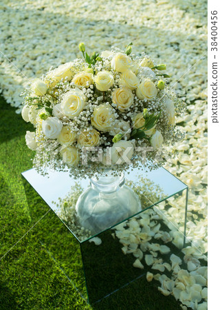 Beautiful wedding ceremony setup on green lawn  38400456