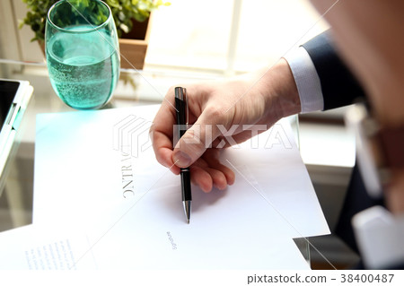 Businessman is signing a contract,contract details 38400487