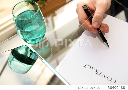 Businessman is signing a contract,contract details Businessman is signing a contract,contract details 38400488