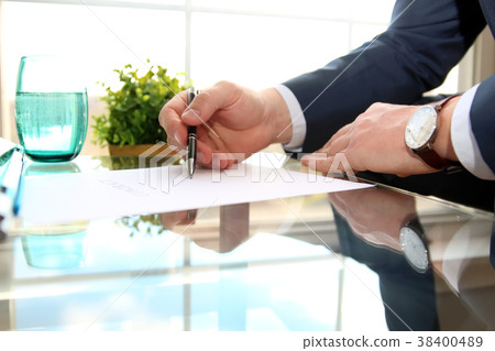 Businessman is signing a contract,contract details Businessman is signing a contract,contract details 38400489