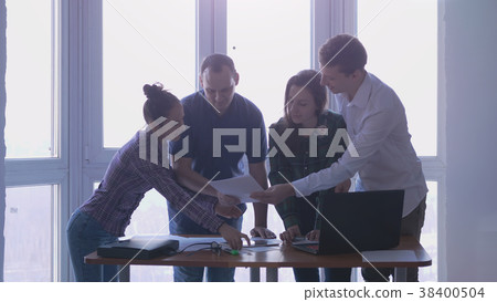 Group of people at the working place are in talks 38400504