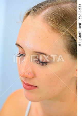 A woman who has given Matsuek (eye closed left side) 38400633