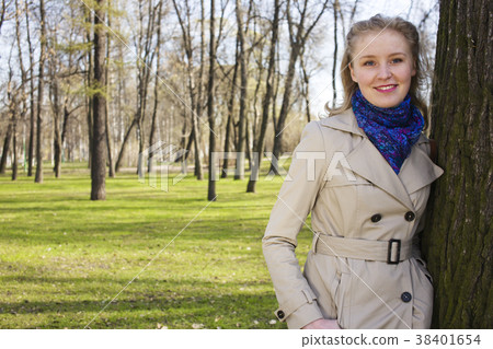 happy blond young woman in green spring park happy blond young woman in green spring park 38401654