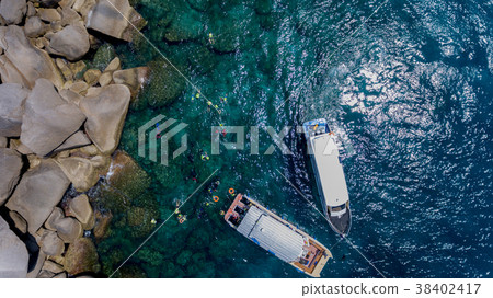 people snorkeling in tropical Coral reef  38402417
