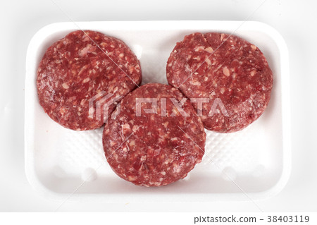 Tray with raw beef burgers isolated on white 38403119