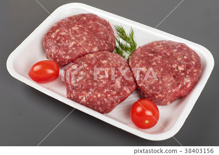Tray with raw beef burgers isolated on gray 38403156