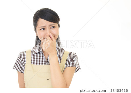 A woman holding a nose 38403416