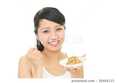 A woman eating natto A woman eating natto 38404155
