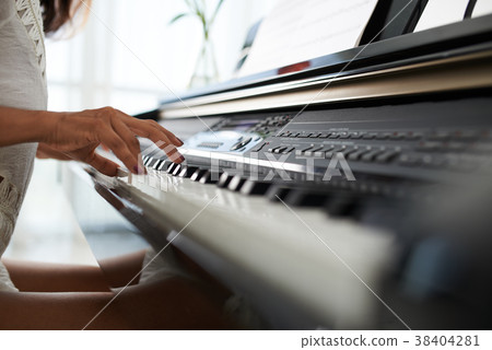 Playing piano 38404281