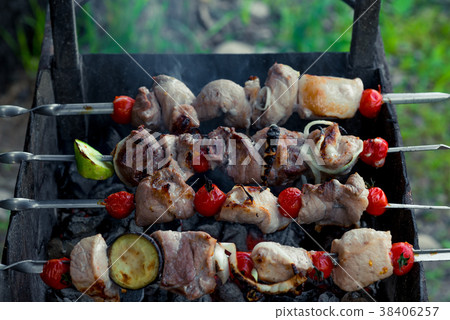 aromatic juicy meat shish kebab with vegetables aromatic juicy meat shish kebab with vegetables 38406257