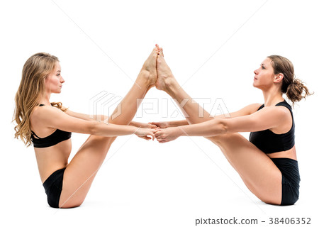 two female athletes doing stretching exercises two female athletes doing stretching exercises 38406352