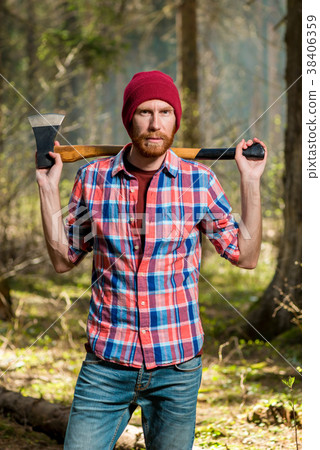 severe bearded forester with a ax  38406359
