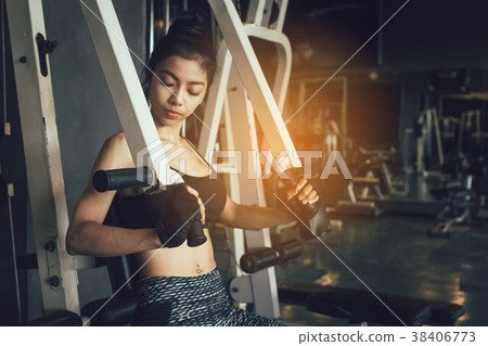 Asian women stronger and pushing weight bar 38406773