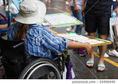 Girls sit the wheelchair  38406940