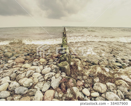 Wooden breakwaters on a shore of the Baltic Sea Wooden breakwaters on a shore of the Baltic Sea 38407900