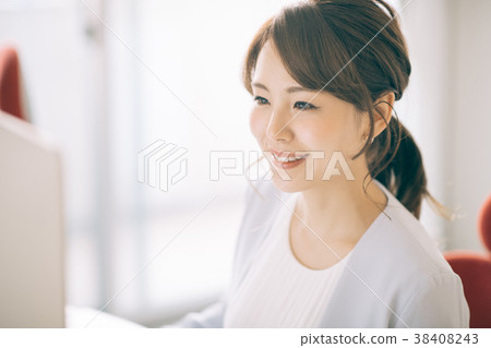 Young woman working in office Young woman working in office 38408243