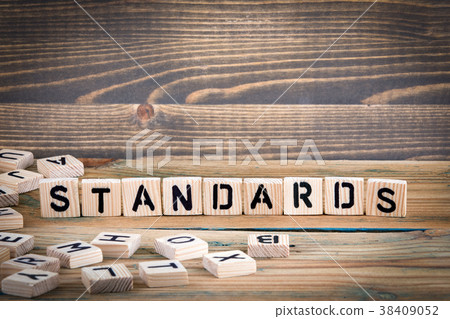 standards. Wooden letters on the office desk, informative and communication background 38409052