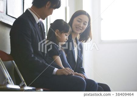 Parents and children waiting for the exam interview 38409464