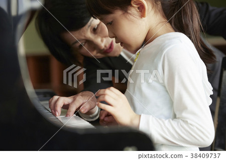 Teachers and students in the music room 38409737