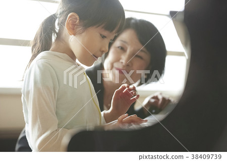 Teachers and students in the music room 38409739