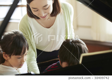 Teachers and students in the music room 38409742