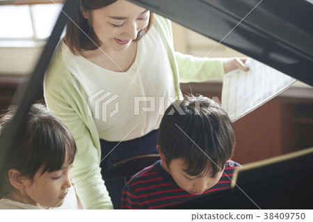 Teachers and students in the music room 38409750