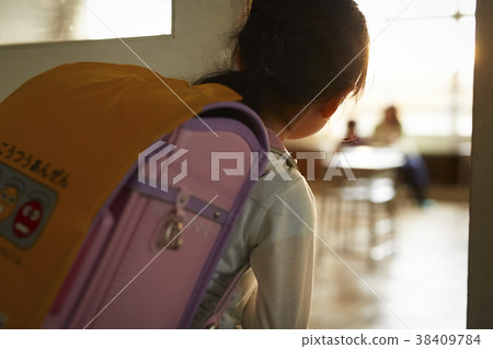 Students looking into a classroom after school Students looking into a classroom after school 38409784